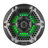 Front view of a carbon-fiber-patterned DS18 speaker with a silver honeycomb grille and green lighting