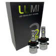 Two LUMI Stage 2 5202 LED Headlight Bulbs from Lumi are shown in front of a black box labeled â€œLUMI LED Headlight Systems Stage II Smart Kitâ€ on a plain background, delivering powerful 6000K illumination.