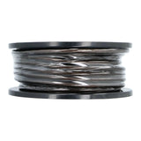 Side view of a black wire spool with translucent outer wrapping