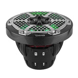 Low-angle view of a carbon-fiber-pattern DS18 speaker with green-lit honeycomb grille and deep basket