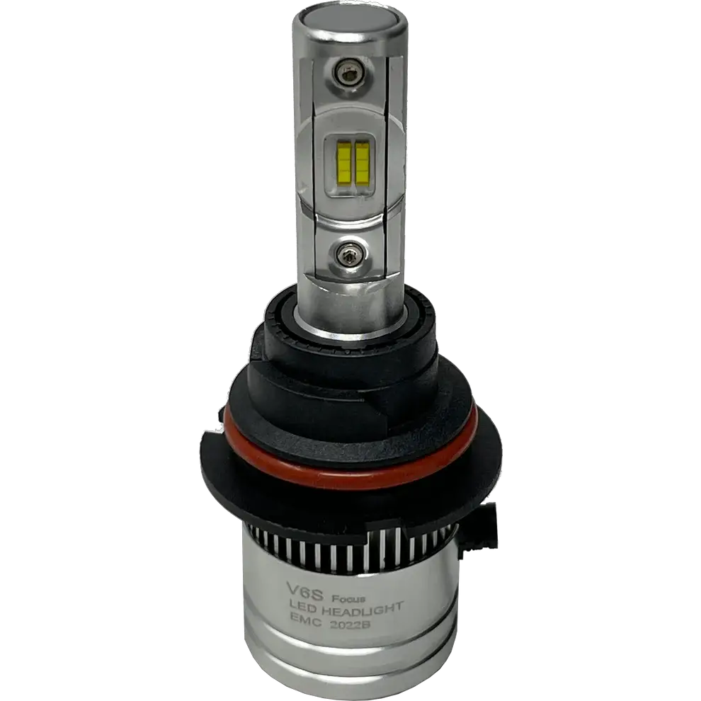 The Lumi LUMI Stage 2 9004 LED headlight bulb features a silver body and a black and red plastic base, labeled â€œV8S Focus LED HEADLIGHT EMC 2022B,â€ and is equipped with advanced CSP chips for superior brightness, displayed against a plain white background.