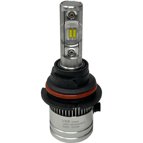 A silver LUMI Stage 2 9006 LED headlight bulb by Lumi, featuring visible yellow CSP chips, black and red rubber rings, and a cylindrical base labeled EMC 2022B, is displayed on a plain white backgroundâ€”ideal for those seeking modern LED headlights with a crisp 6000K output.
