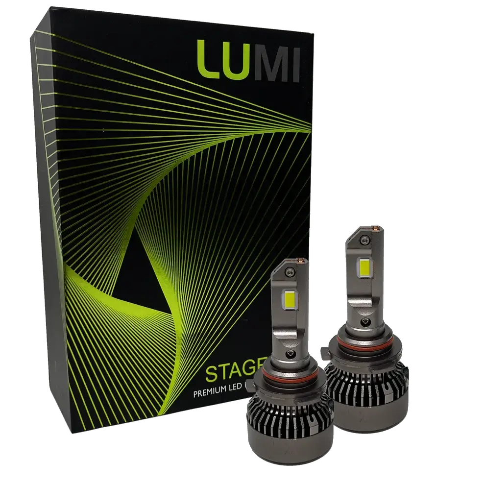 Two LUMI Stage 3 9006 LED headlight bulbs with heatsinks are displayed in front of a black Lumi box adorned with green and yellow curved line graphics, highlighting premium LED headlights that feature advanced CSP chips and a bright 6000K color temperature.