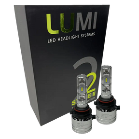 Two LUMI Stage 2 9007 LED Headlight Bulbs from Lumi, featuring advanced CSP chips and a crisp 6000K color temperature, are displayed in front of a black box labeled LUMI LED Headlight Systems 2 Series II Headlight Kit.