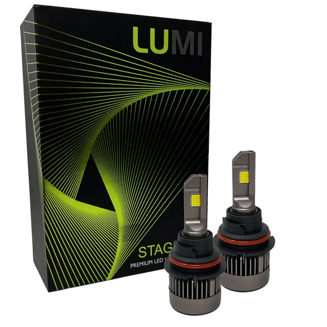Two LUMI Stage 3 9007 LED Headlight Bulbs with advanced CSP chips and a bright 6000K color temperature are shown in front of a black Lumi box accented with green lines and the text â€œSTAGE PREMIUM LED.â€.