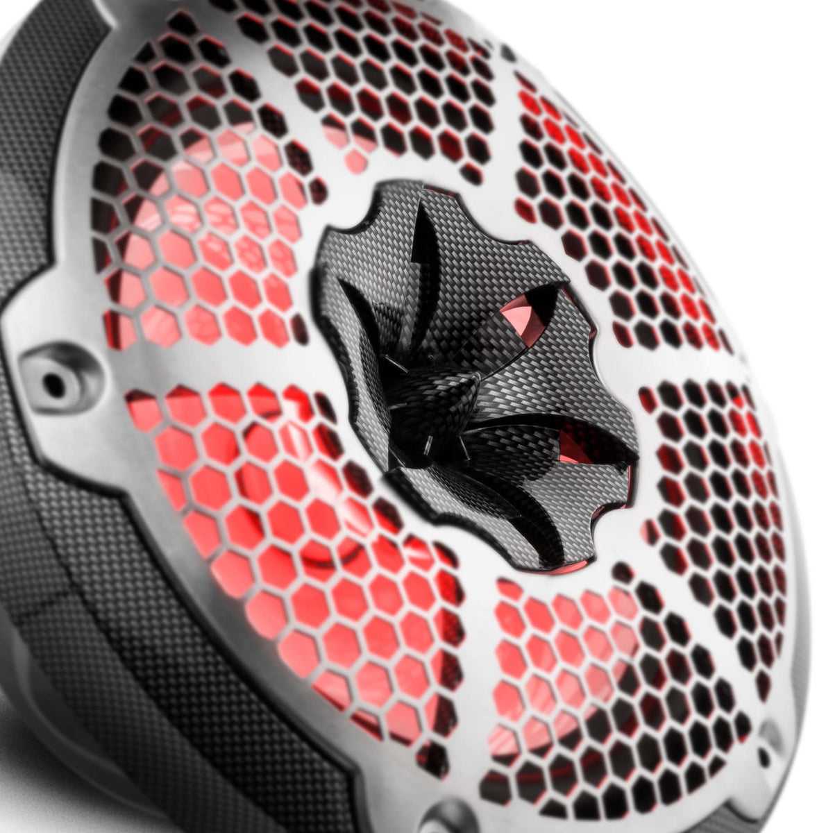Close-up of a carbon-fiber-pattern DS18 speaker's honeycomb grille and red-lit central tweeter
