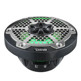 Low-angle view of a carbon-fiber-pattern DS18 speaker with silver honeycomb grille and green illumination