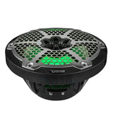 Low angled view of a DS18 speaker with green lighting behind its silver grille, carbon-fiber-patterned rim and black basket.