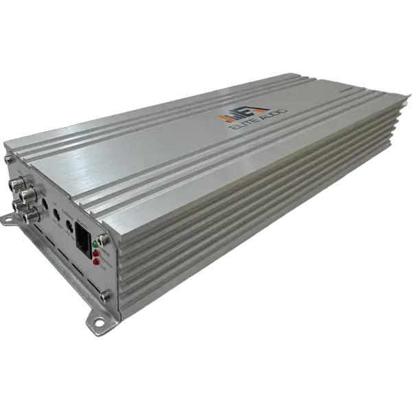 The Elite Audio EA4000M is a silver, rectangular monoblock car amplifier with ribbed sides and the Elite Audio logo displayed prominently on top. Designed for competition-level performance, it features advanced high-speed MOSFET circuitry to ensure powerful and clear audio output. The front panel includes various input and output ports, control switches, and LED indicators. The amplifier is shown photographed against a white background.