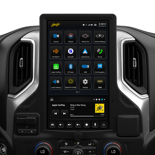 Tall Stinger touchscreen installed between dashboard vents, showing app icons above Apple CarPlay music controls