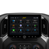 Stinger touchscreen installed between dashboard vents, displaying its camera, climate, vehicle-information and audio-source menu