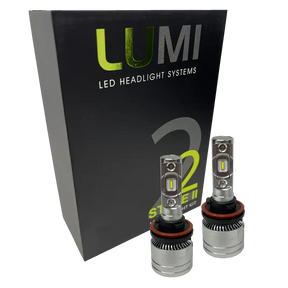 Two metallic Lumi Stage 2 H11 LED Headlight Bulbs, equipped with advanced CSP chips and delivering a crisp 6000K color temperature, are displayed in front of a black Lumi LED Headlight Systems box featuring â€œStage IIâ€ and â€œ2â€ branding.