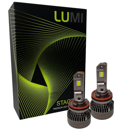 Two LUMI Stage 3 H11 LED headlight bulbs from Lumi, featuring advanced CSP chips, are displayed in front of a black box with green wavy lines and the words â€œSTACKâ€ and â€œPremium LED Headlightsâ€ on the packaging, emphasizing their impressive 6000K brightness for superior visibility.