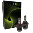 Two LUMI Stage 3 H13 LED headlight bulbs featuring advanced CSP chips are displayed in front of a black Lumi-branded box with green lines and patterns. The bulbs have metallic bases and visible yellow LED chips, delivering brilliant 6000K illumination for superior visibility.