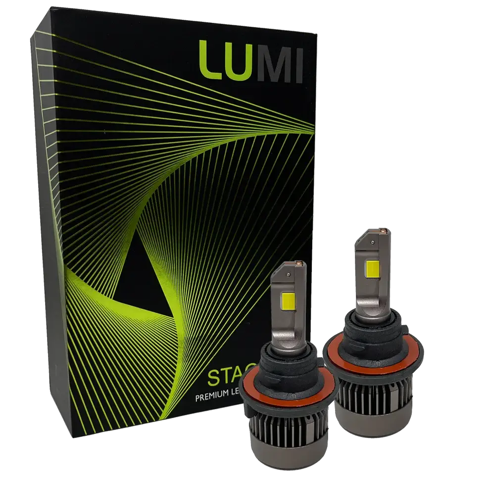 Two LUMI Stage 3 H13 LED headlight bulbs featuring advanced CSP chips are displayed in front of a black Lumi-branded box with green lines and patterns. The bulbs have metallic bases and visible yellow LED chips, delivering brilliant 6000K illumination for superior visibility.