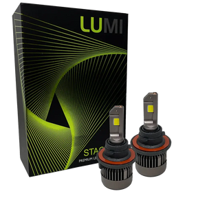 Two LUMI Stage 3 H13 LED headlight bulbs featuring advanced CSP chips are displayed in front of a black Lumi-branded box with green lines and patterns. The bulbs have metallic bases and visible yellow LED chips, delivering brilliant 6000K illumination for superior visibility.