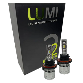Two LUMI Stage 2 H13 LED Headlight Bulbs by Lumi, featuring advanced CSP chips, are displayed in front of a black box labeled â€œLUMI LED Headlight Systems 2 Stage II Series Kit.â€.