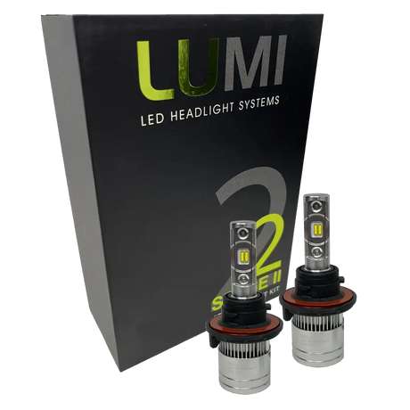 Two LUMI Stage 2 H13 LED Headlight Bulbs by Lumi, featuring advanced CSP chips, are displayed in front of a black box labeled â€œLUMI LED Headlight Systems 2 Stage II Series Kit.â€.