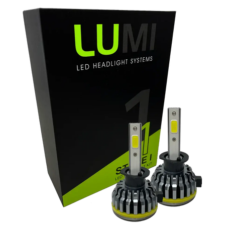 Two LUMI Stage 1 H1 LED Headlight Bulbs are displayed in front of a black and green Lumi box labeled â€œStage 1 LED Headlight Kit,â€ featuring a powerful 40-watt output and a crisp 6000K color temperature for superior visibility.