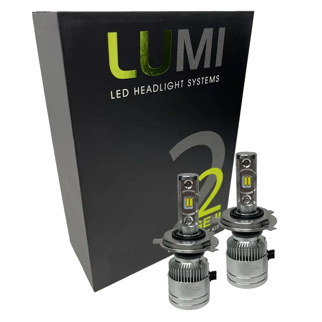 Two LUMI Stage 2 H4 LED Headlight Bulbs with advanced CSP chips are displayed in front of a black Lumi LED Headlight Systems box featuring green and white text, highlighting their brilliant 6000K illumination.