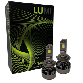 Two Lumi Stage 3 H7 LED headlight bulbs, equipped with advanced CSP chips and offering a bright 6000K color temperature, are displayed in front of a black box accented with green lines and the LUMI logo. The packaging also features the text â€œSTACKâ€ and â€œPremium LED Headlights.â€.