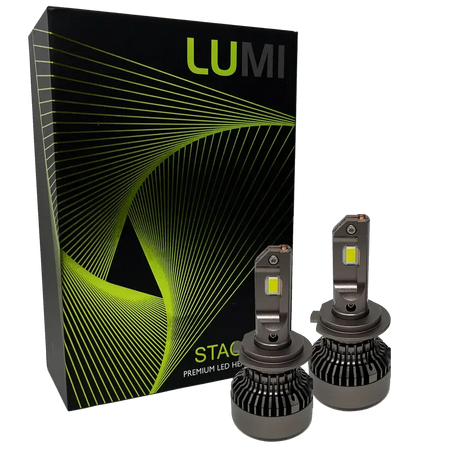 Two Lumi Stage 3 H7 LED headlight bulbs, equipped with advanced CSP chips and offering a bright 6000K color temperature, are displayed in front of a black box accented with green lines and the LUMI logo. The packaging also features the text â€œSTACKâ€ and â€œPremium LED Headlights.â€.