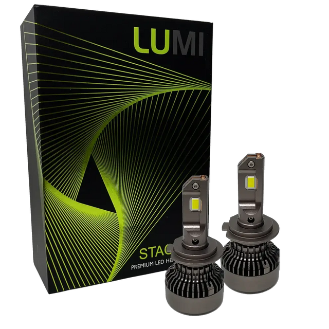 Two Lumi Stage 3 H7 LED headlight bulbs, equipped with advanced CSP chips and offering a bright 6000K color temperature, are displayed in front of a black box accented with green lines and the LUMI logo. The packaging also features the text â€œSTACKâ€ and â€œPremium LED Headlights.â€.
