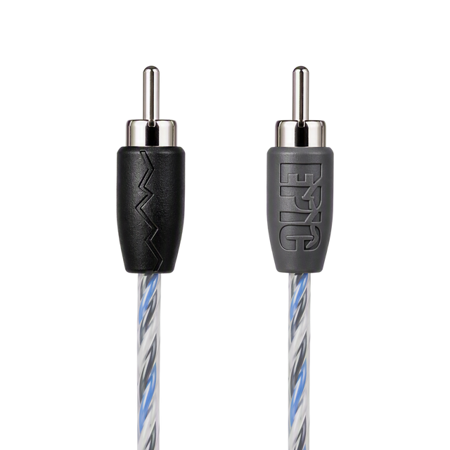 Close-up of a braided audio cable showing two RCA-style connectors on a white background. One connector has a black sleeve with a zigzag cutout, and the other has a gray sleeve with the embossed brand name 'F&G'.