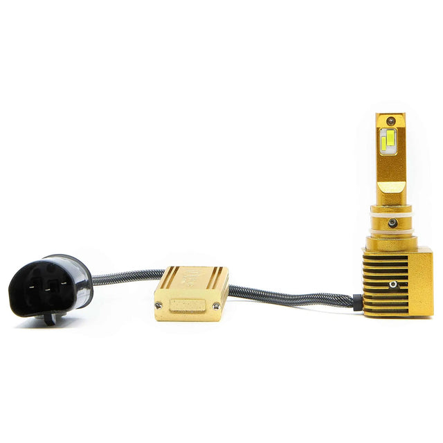 Gold-colored LED bulb with a square finned base, inline driver module and round black connector