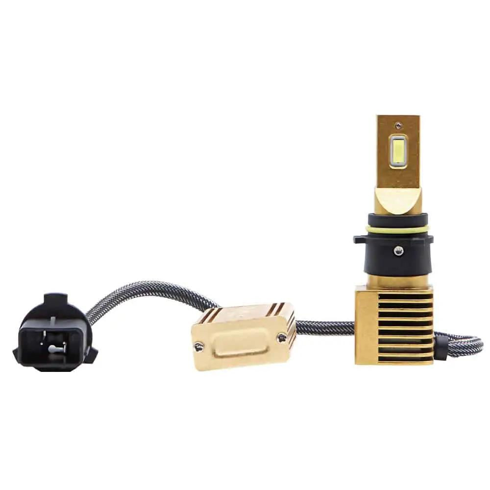Gold-colored LED bulb with a black collar, yellow ring, square finned base, inline module and black connector