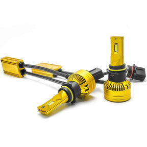 Pair of gold-colored LED bulbs with black mounting collars, round finned bases and wired driver modules