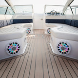 White speakers with multicolor lighting installed beneath the seats of a boat