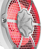 Close-up of a white DS18 speaker's honeycomb grille and central tweeter with red illumination