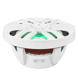 Low-angle view of a white DS18 speaker showing green illumination, open basket and red suspension