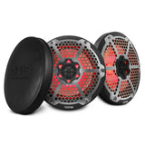 Two black DS18 speakers with silver honeycomb grilles and red lighting beside a protective cover