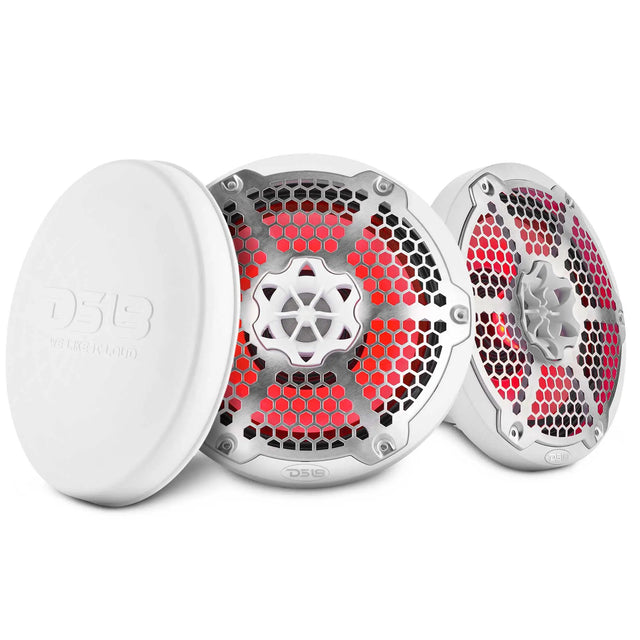 Two white DS18 speakers with silver honeycomb grilles and red lighting beside a protective cover