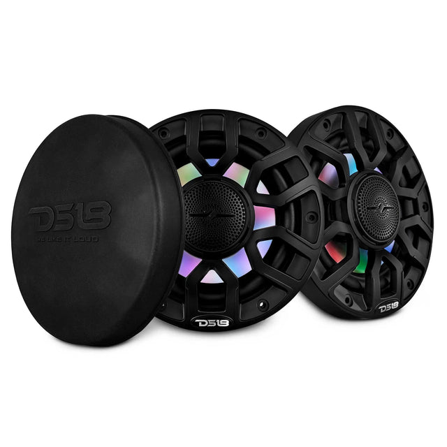 Two black DS18 speakers with multicolor lighting beside a round protective cover