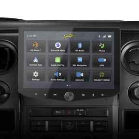 Stinger touchscreen installed in a vehicle dashboard, displaying its main app menu above the factory controls