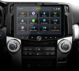 Stinger touchscreen installed above two large climate-control knobs, displaying its source-selection menu