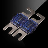 Two blue 60-amp mini fuses against a black background