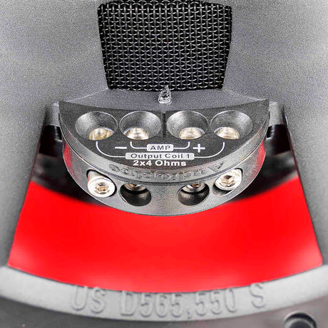 Close-up of subwoofer terminals marked 2x4 Ohms, with polarity symbols and connection screws