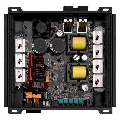 Open amplifier showing its circuit board, two yellow transformers and cooling fan