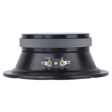 Rear side view of a shallow black speaker showing its gray magnet and two spade terminals