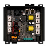 Open amplifier showing its circuit board, yellow transformers and internal components