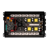 Open amplifier showing its circuit board, black capacitors, copper coils, yellow transformers and metal mounting rails