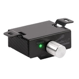 Amplifier remote control with a silver adjustment knob and green power indicator