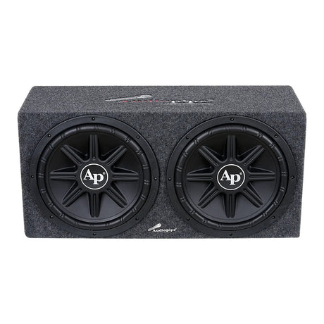 Angled front view of a gray-carpeted enclosure with two black AP-logo subwoofers