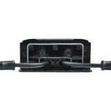 Amplifier end panel with two black cables passing through sealed openings