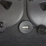 USB socket beneath an open rubber cover between two soundbar speakers