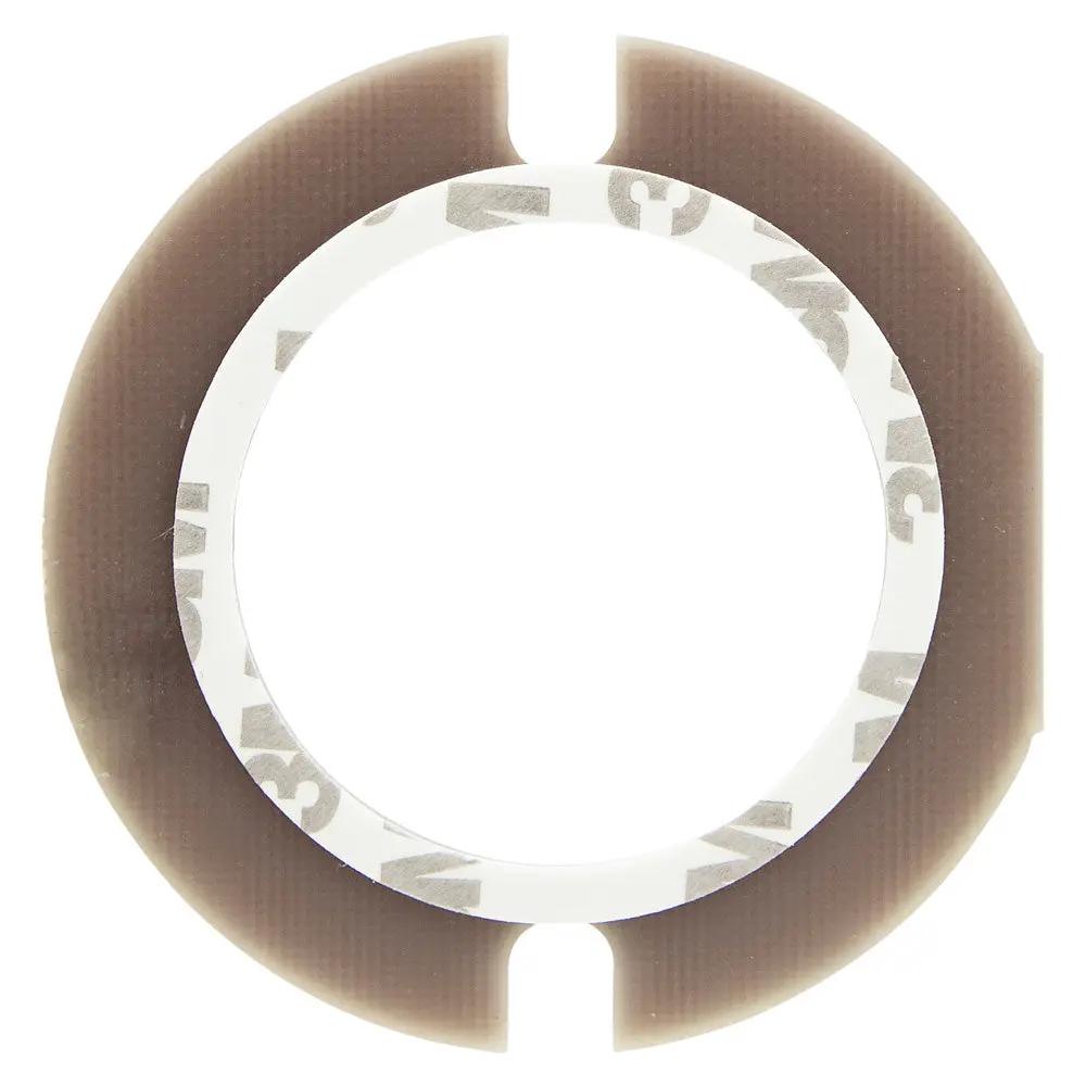 Saddle Tramp circular LED housing adapter with its adhesive backing visible